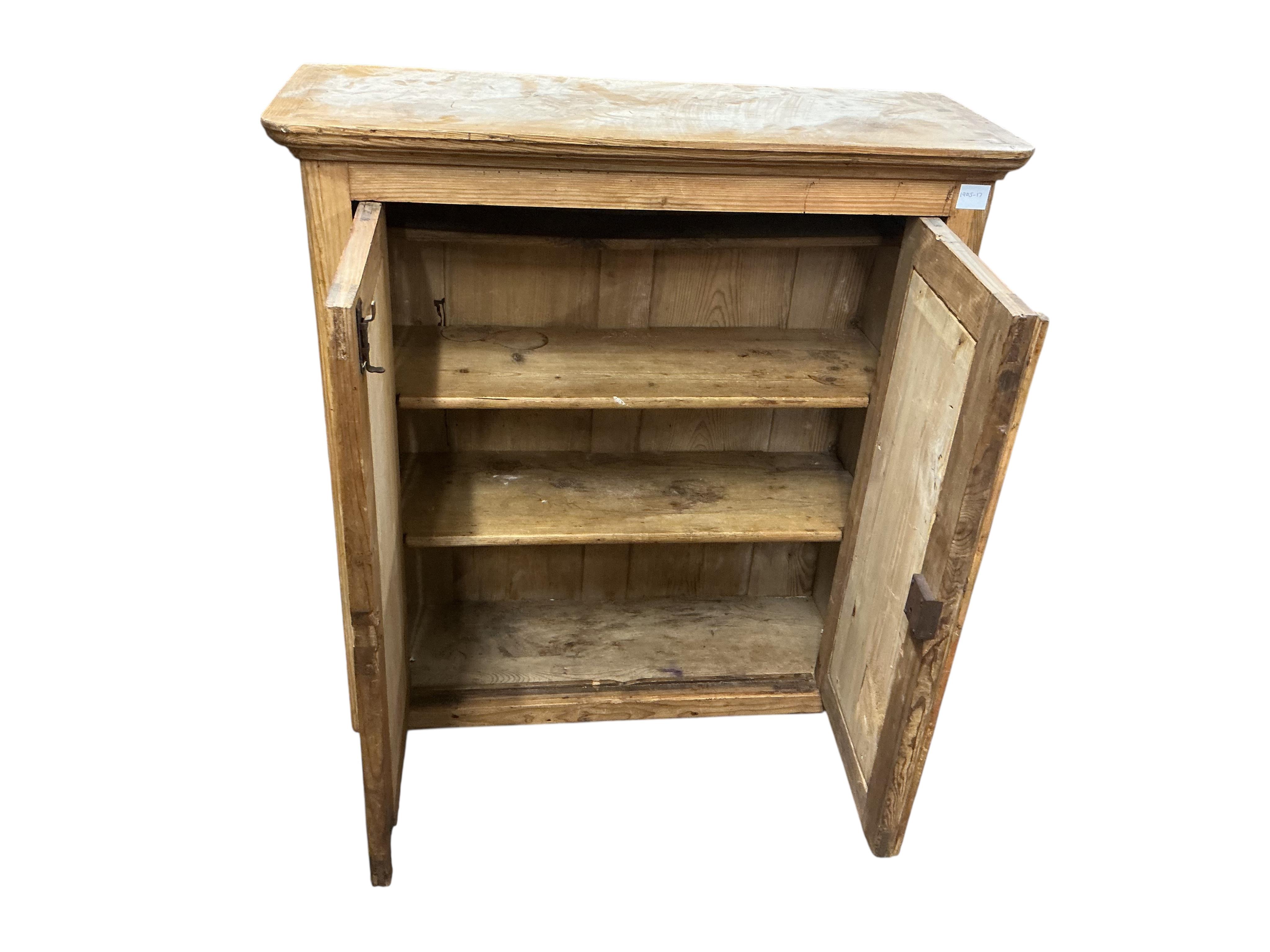 A Victorian pine two door cabinet, width 95cm, depth 37cm, height 97cm